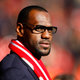 US and Miami Heat basketball player LeBron James looks on before the English Premier League soccer match between Liverpool and Manchester United at Anfield, Liverpool, England, Saturday Oct. 15, 2011.